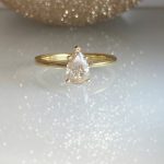 pear shaped champagne salt and pepper diamond solitaire engagement ring in yellow gold.jpeg | Posy Fine Jewellery Toronto